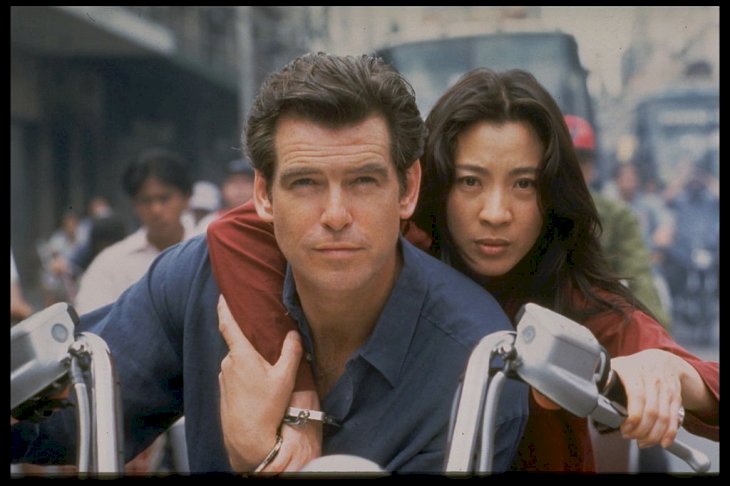 Image Credit: Getty Images / Michelle Yeoh with her James Bond, Pierce Brosnan.