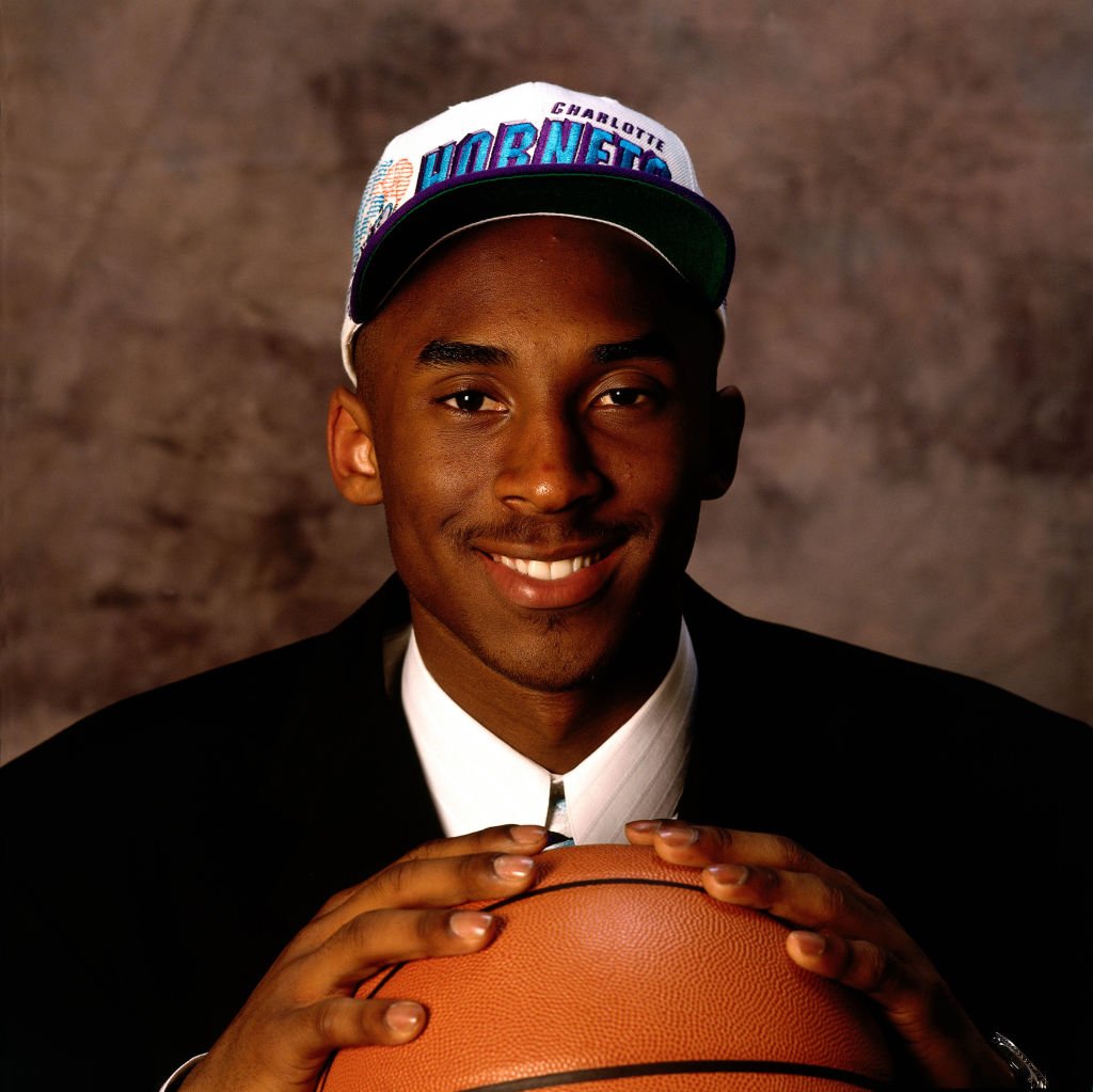 Image Credit: Getty Images / Kobe Bryant poses for a portrait during the Rookie Shoot circa June 1996.