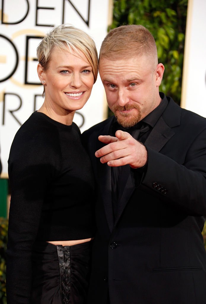 Image Source: Getty Images/Jeff Vespa/Actress Robin Wright (L) and actor Ben Foster attend the 72nd Annual Golden Globe Awards at The Beverly Hilton Hotel on January 11, 2015