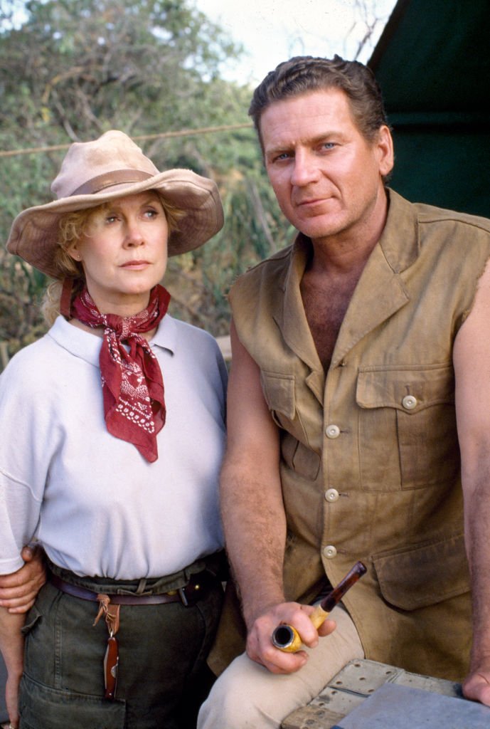 Image Credits: Getty Images / CBS | Face to Face, a made-for-TV movie. A conflict between two professionals, leads to love, amidst challenged tribal traditions in the African savannah. Pictured is Robert Foxworth (as Tobias Williams, miner) and Elizabeth Montgomery (as Dr. Diana Firestone, a paleontologist). Photo dated December 1, 1988. Originally broadcast January 24, 1990. Shot on location in Kenya, Africa. Image Credits: Getty Images / CBS | Face to Face, a made-for-TV movie. A conflict between two professionals, leads to love, amidst challenged tribal traditions in the African savannah. Pictured is Robert Foxworth (as Tobias Williams, miner) and Elizabeth Montgomery (as Dr. Diana Firestone, a paleontologist). Photo dated December 1, 1988. Originally broadcast January 24, 1990. Shot on location in Kenya, Africa.