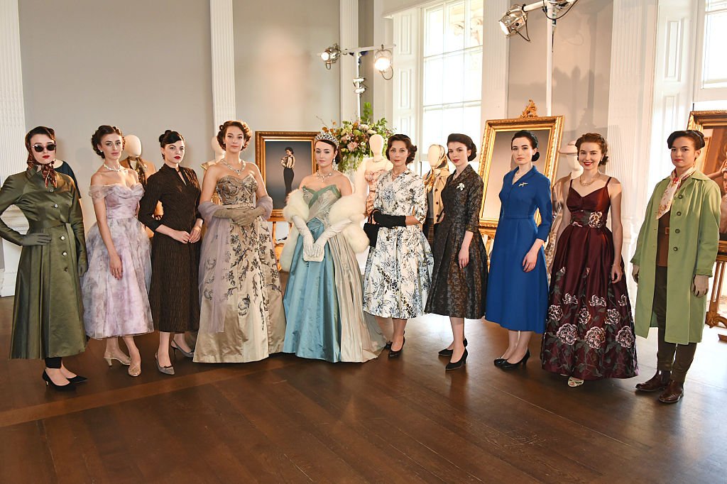 Image Credits: Getty Images / David M. Benett / Dave Benett | Models pose at a presentation featuring costumes from new Netflix Original series "The Crown" with designer Michele Clapton at the ICA on October 17, 2016 in London, England.
