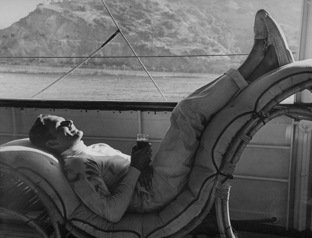 Image Source: Getty Images / Actor Errol Flynn (1909-1959), known as the king of swashbuckler films, on a boat.