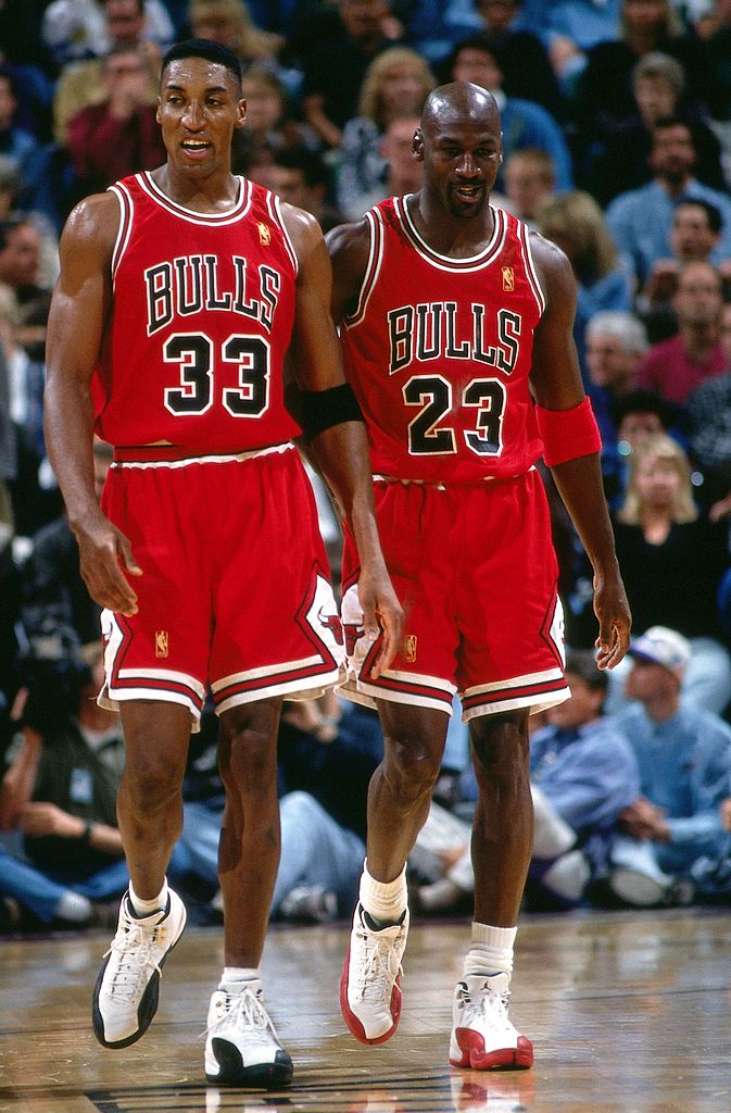 Image Credits: Getty Images / Andy Hayt / NBAE | Scottie Pippen #33 and Michael Jordan #23 of the Chicago Bulls walk upcourt during a 1997 NBA game at the Delta Center in Salt Lake City, Utah.