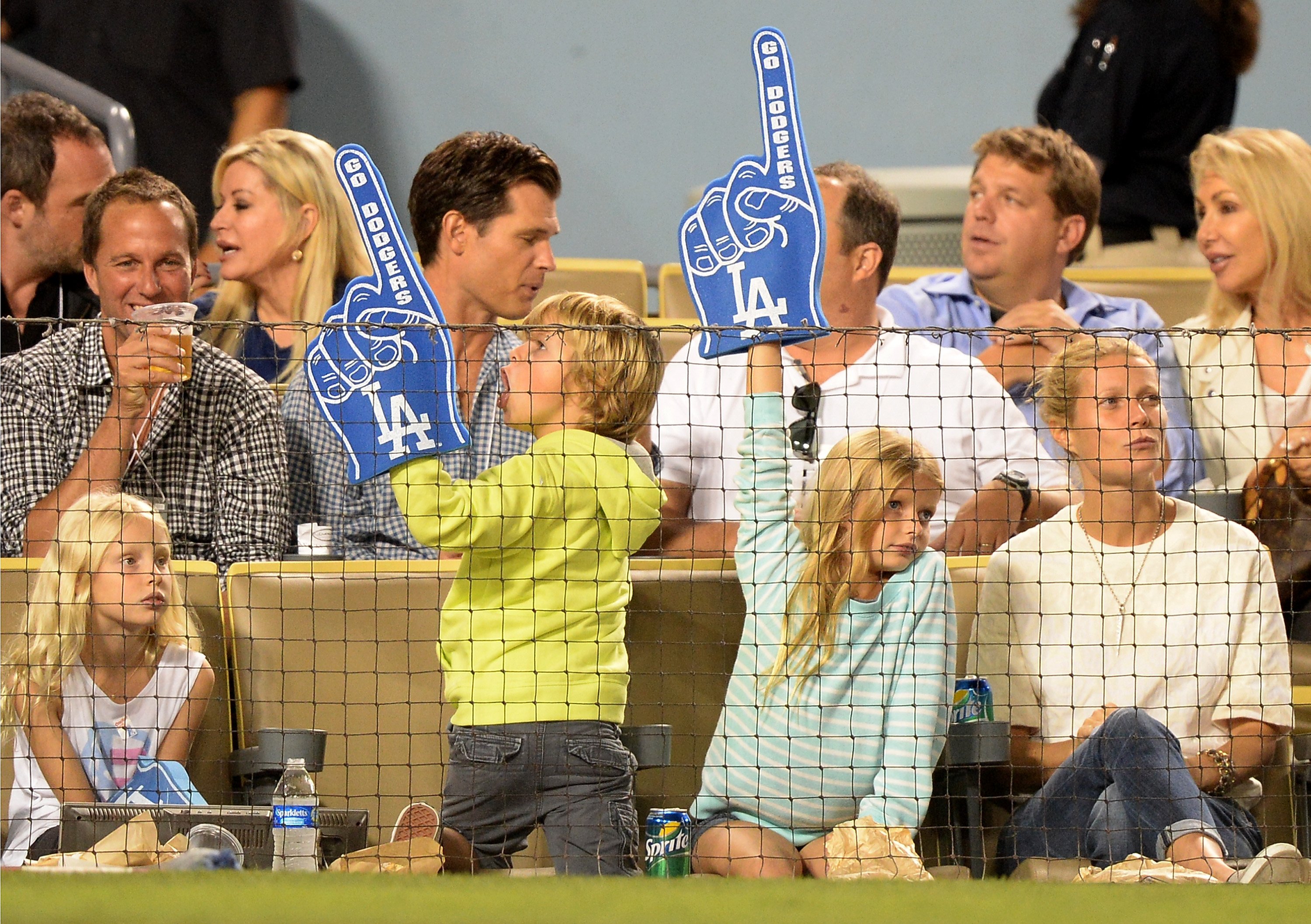 Image Credits: Getty Images / Harry How | Actress Gwyneth Paltrow (R) and Moses Martin and Apple Martin watch the game between the Arizona Diamondbacks and the Los Angeles Dodgers at Dodger Stadium on September 11, 2013 in Los Angeles, California. Image Credits: Getty Images / Harry How | Actress Gwyneth Paltrow (R) and Moses Martin and Apple Martin watch the game between the Arizona Diamondbacks and the Los Angeles Dodgers at Dodger Stadium on September 11, 2013 in Los Angeles, California.