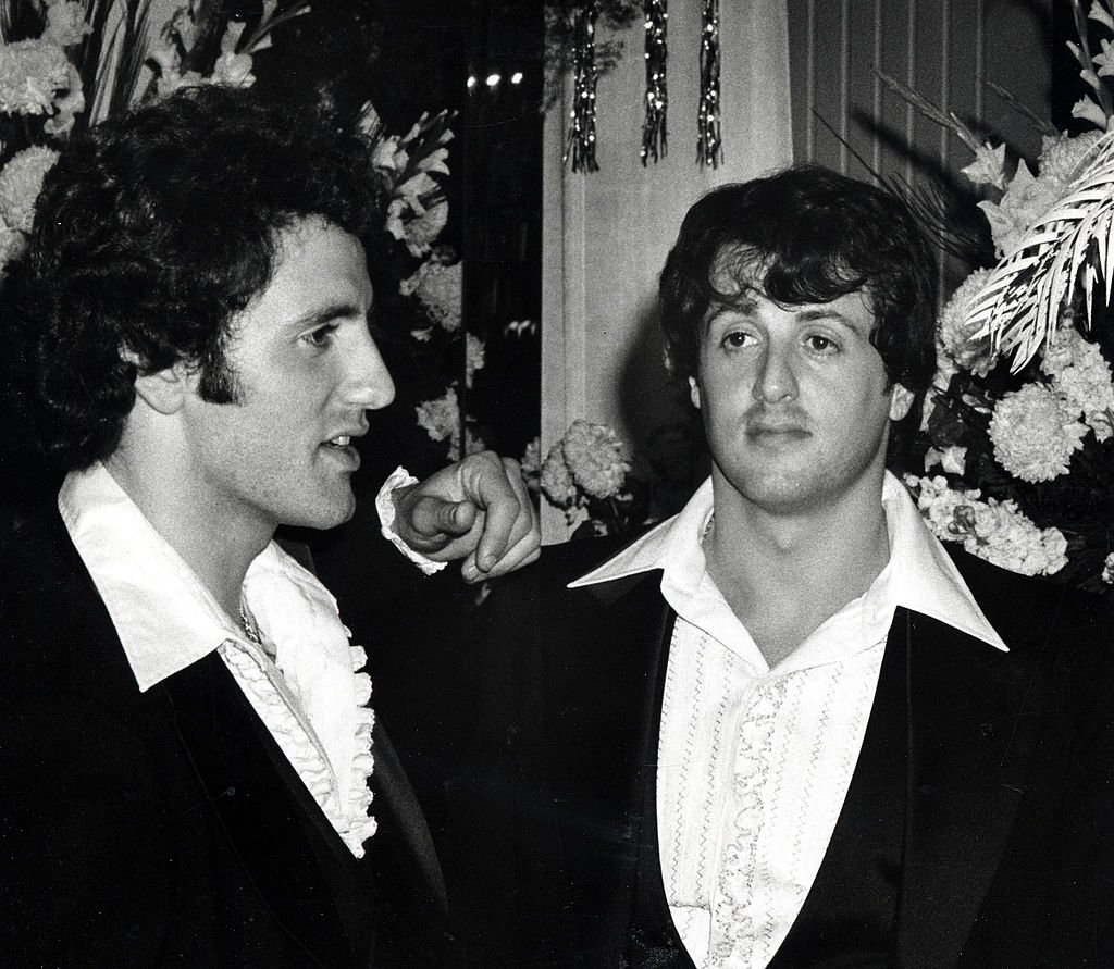 Image Credits: Getty Images / Ron Galella / Ron Galella Collection | Frank Stallone and Sylvester Stallone during 49th Annual Academy Awards at Dorothy Chandler Pavillion in Los Angeles, California, United States.