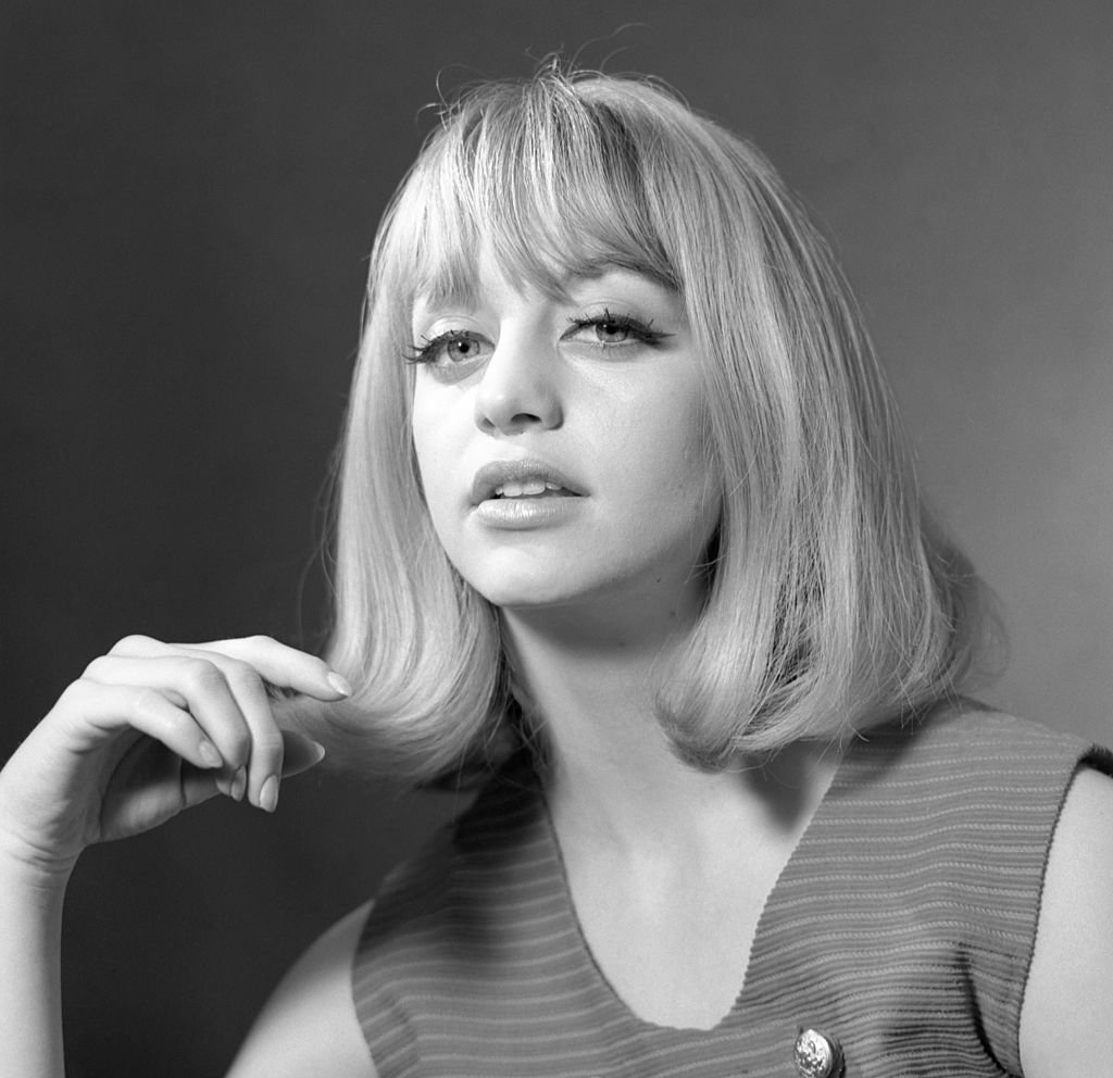 Image Credit: Getty Images / Portrait of American actress Goldie Hawn, in a sleeveless outfit, as she plays with her hair, Arlington, Virginia, March 28, 1965. Image Credit: Getty Images / Portrait of American actress Goldie Hawn, in a sleeveless outfit, as she plays with her hair, Arlington, Virginia, March 28, 1965.