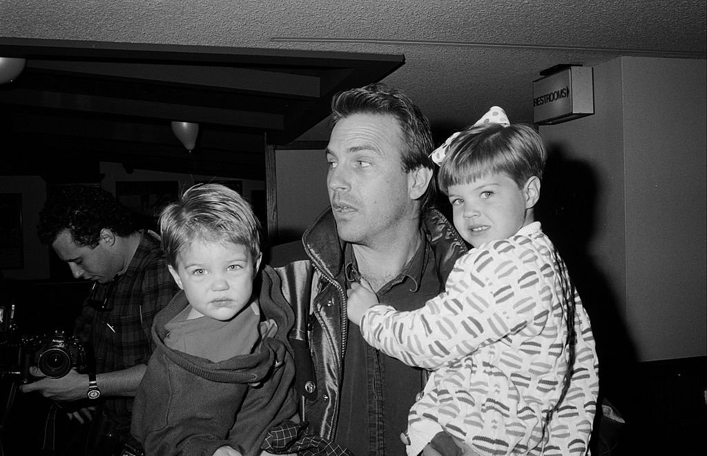 Image Credit: Getty Images / Kevin Costner, Lily, Joe and Annie Costner in 1990. Image Credit: Getty Images / Kevin Costner, Lily, Joe and Annie Costner in 1990.