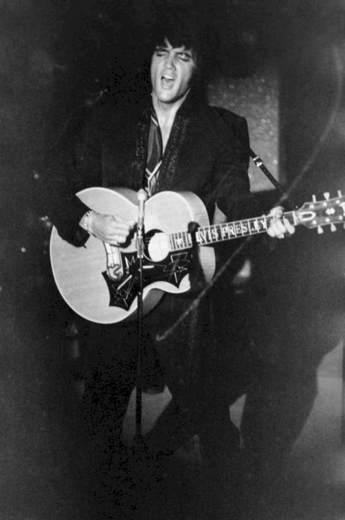 Image Credit: Getty Images / Rock 'n' roll singer and actor Elvis Presley (1935 - 1977) performs at the Las Vegas International Hotel, August 1969.