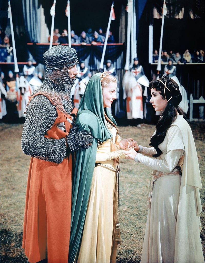 Image Source: Getty Images/Corbis/Sunset Boulevard/Colorised photo of Joan Fontaine with Elizabeth Taylor and Robert Taylor on the set of Ivanhoe