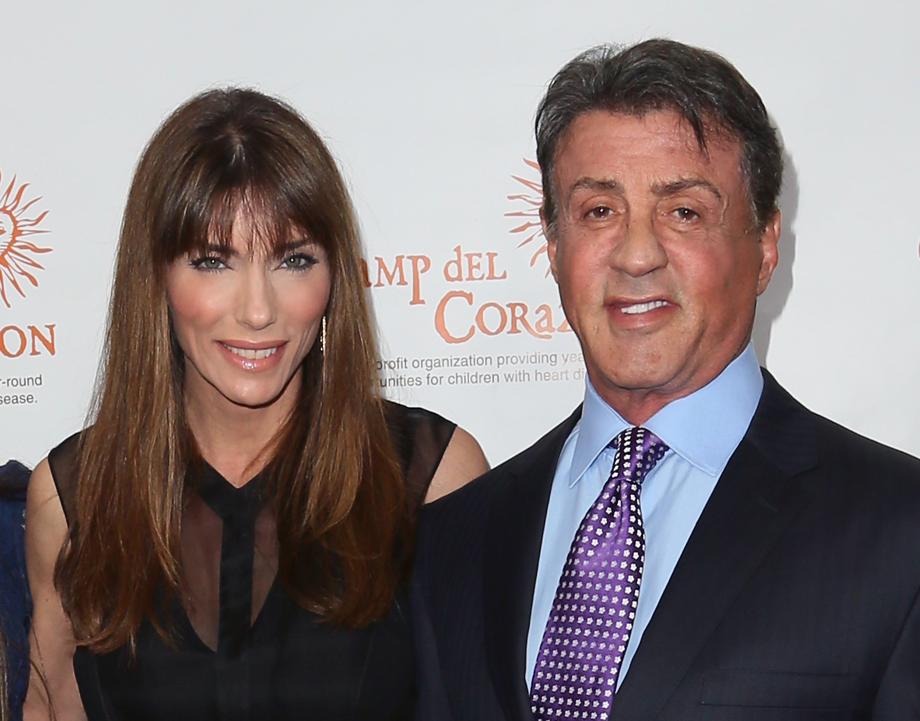 Image Credits: Getty Images / David Livingston | Actor Sylvester Stallone (R) and wife Jennifer Flavin attend Camp del Corazon's 11th Annual Gala del Sol at the Ray Dolby Ballroom at Hollywood & Highland Center on April 19, 2014 in Hollywood, California.