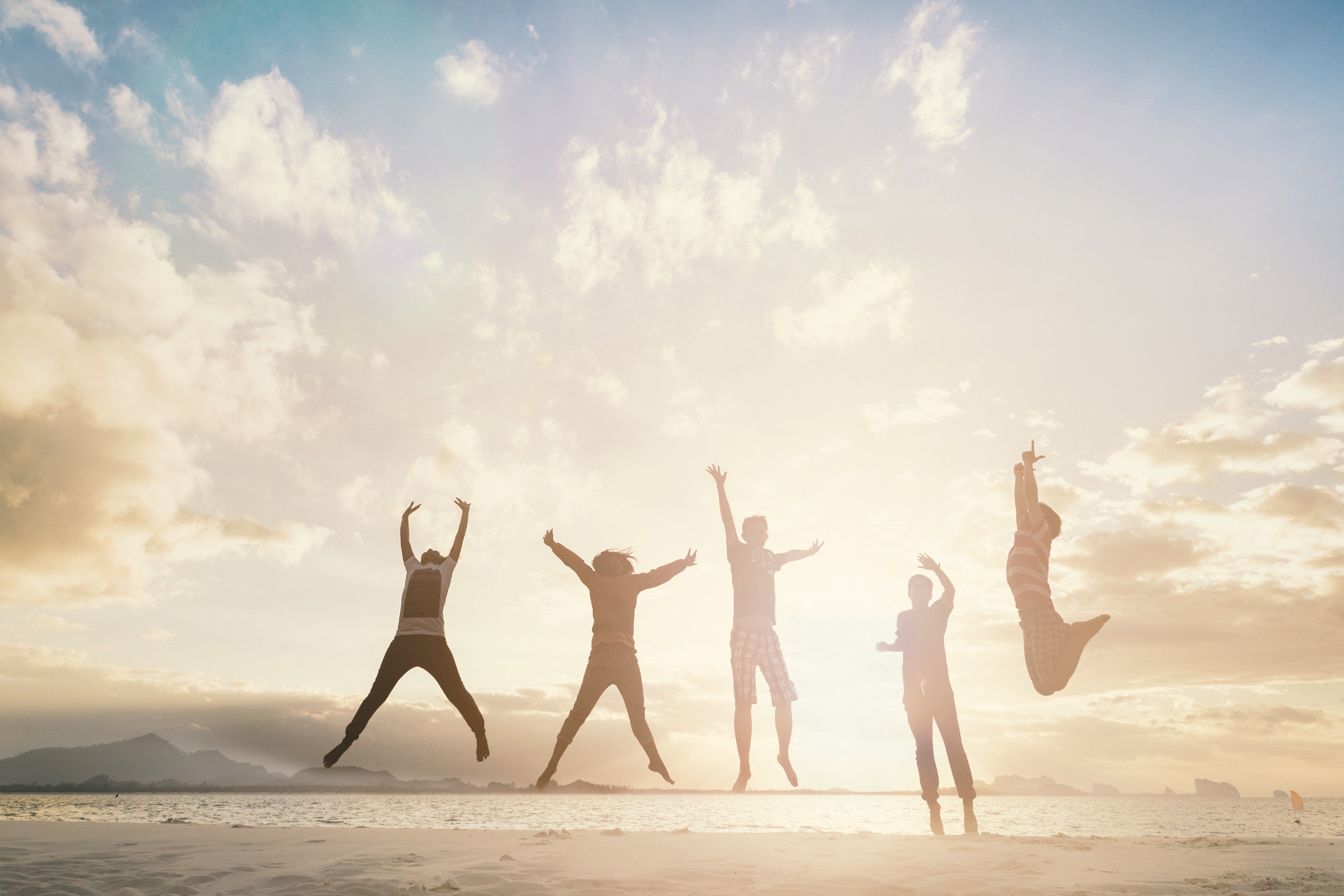Image Credits: Shutterstock / Friends jumping
