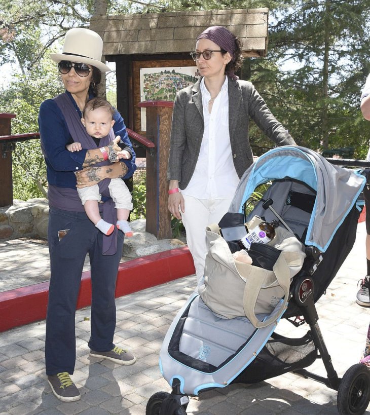 Image Credit: Getty Images/Michael Bezjian | Linda Perry and actress Sara Gilbert attend Amazon Video's Tumble Leaf Family Fun Day with their kids