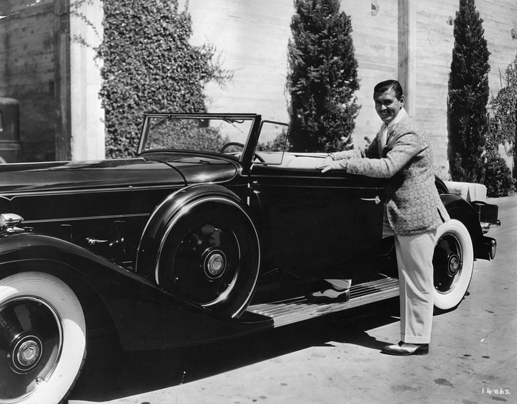 Image Credit: Getty Images / American actor Clark Gable posing with his sports car at the MGM studios. Image Credit: Getty Images / American actor Clark Gable posing with his sports car at the MGM studios.