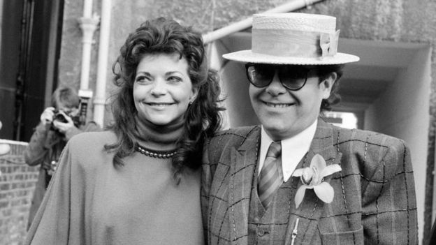 Image Credits: Getty Images / Elton John photographed with his former wife, Renate.