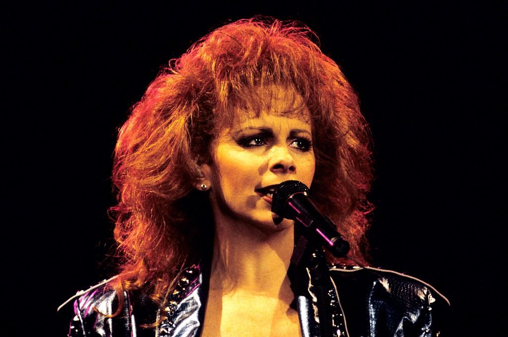 Image Credit: Getty Images / Acclaimed singer and actress, Reba McEntire on stage.