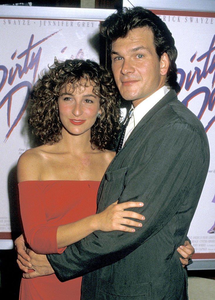 Image Credits: Getty Images / Jim Smeal / Ron Galella Collection | Actors Jennifer Grey and Patrick Swayze attend the premiere of "Dirty Dancing" at the Gemini Theater on August 17, 1987 in New York City.