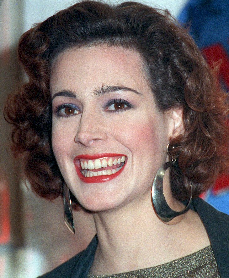 Image Credit: Getty Images/Kypros | Sean Young attends the opening of Planet Hollywood in Costa Mesa, California, 23rd October 1992.