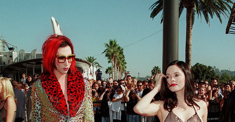 Image Credit: Getty Images / Marilyn Manson and girlfriend actress Rose Mac Gowan arrive at the MTV music awards in 1998.