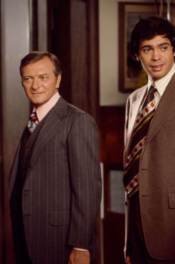 Image Credits: Getty Images / Walt Disney Television | (L-R) George Grizzard, Reni Santoni appearing in the TV movie 'Indict and Convict'.