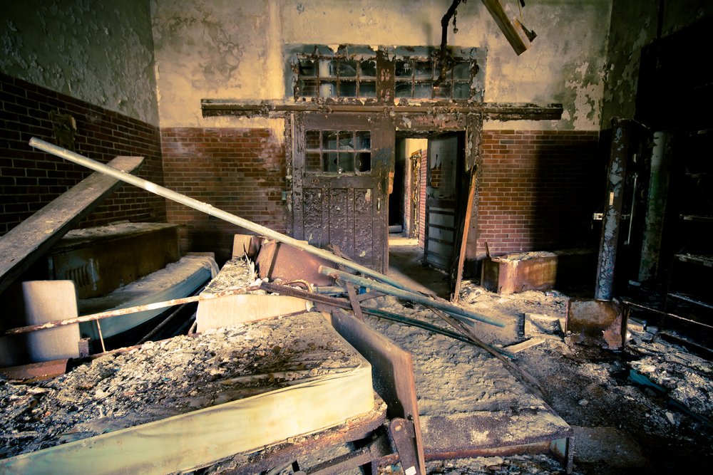 Abandoned and decayed building at historic Kings Park Psychiatric Hospital | Shutterstock Abandoned and decayed building at historic Kings Park Psychiatric Hospital | Shutterstock