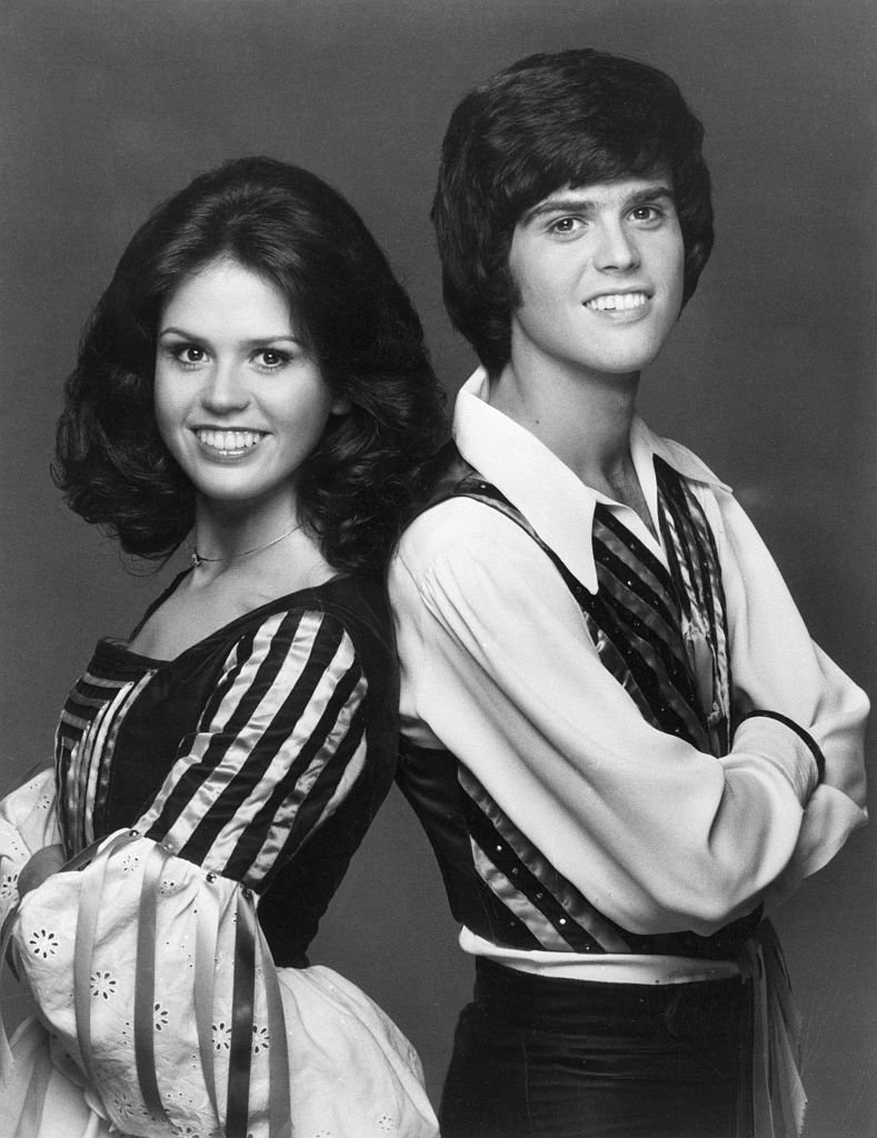 Image Credits: Getty Images / Bettmann | Portrait of sibling singers Donny and Marie Osmond, 1975.