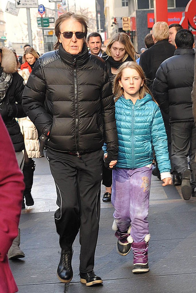 Image Credits: Getty Images / Demis Maryannakis / Star Max / FilmMagic | Musician Sir Paul McCartney and his daughter, Beatrice McCartney, are seen on December 19, 2013 in New York City.