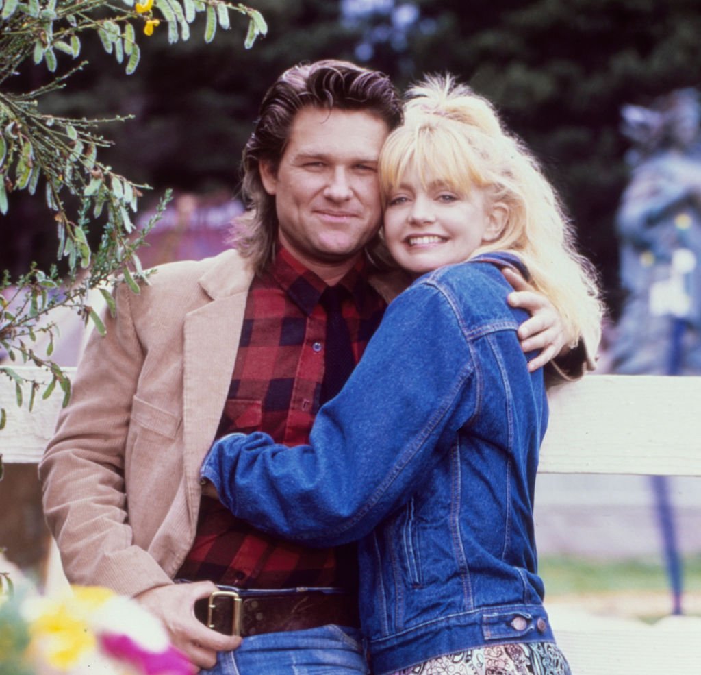 Image Credits: Getty Images / Aaron Rapoport / Corbis | While shooting the movie "Overboard", actors Goldie Hawn and Kurt Russell pose for a portrait in October 1987 in Fort Bragg, California.
