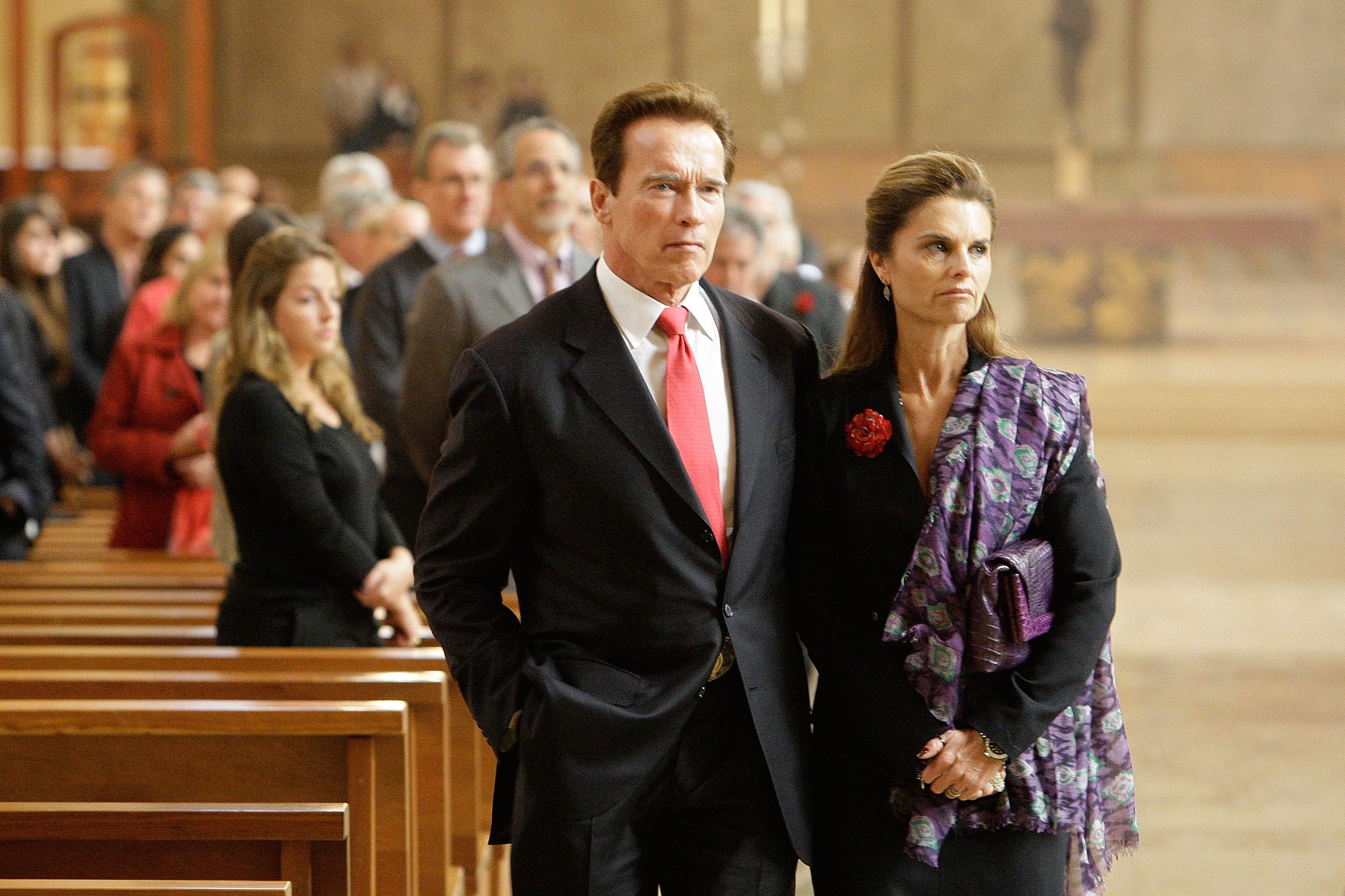 Image Credits: Getty Images / Reed Saxon-Pool | California Governor Arnold Schwarzenegger and wife Maria Shriver attend the funeral Mass for Italian film mogul and Hollywood producer Dino De Laurentiis at the Cathedral of Our Lady of the Angels on November 15, 2010 in Los Angeles, California. Image Credits: Getty Images / Reed Saxon-Pool | California Governor Arnold Schwarzenegger and wife Maria Shriver attend the funeral Mass for Italian film mogul and Hollywood producer Dino De Laurentiis at the Cathedral of Our Lady of the Angels on November 15, 2010 in Los Angeles, California.
