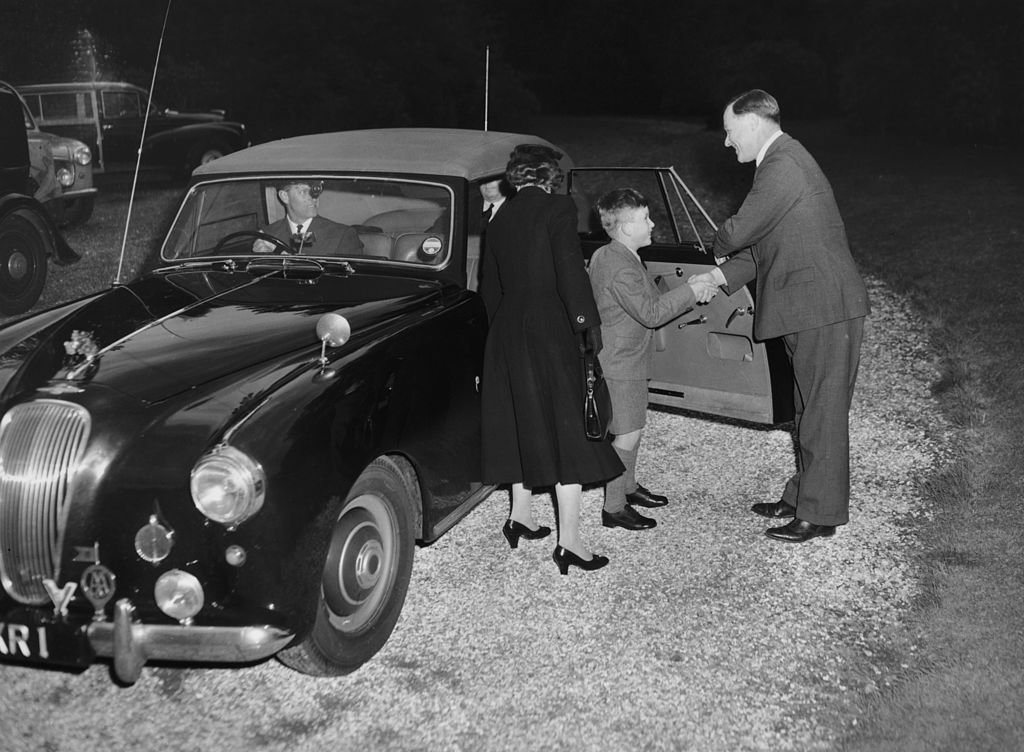 Image Credit: Getty Images / Prince Charles arrives at Cheam School in Berkshire to start his first term, and is introduced to the headmaster, Peter Beck, 23rd September 1957.