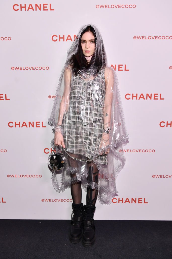 Image Credit: Getty Images / Grimes, wearing Chanel, attends a Chanel Party to celebrate the Chanel Beauty House on February 28, 2018 in Los Angeles, California.
