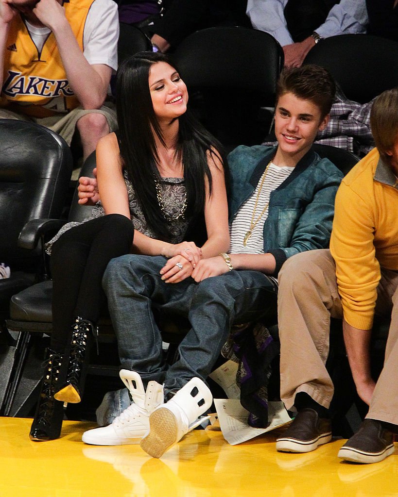 Image Source: Getty Images/Noel Vasquez/Selena Gomez (L) and Justin Bieber attend a basketball game between the San Antonio Spurs and the Los Angeles Lakers at Staples Center on April 17, 2012