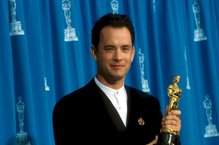 Image Credits: Getty Images / John Barr / Liaison | Actor Tom Hanks receives his Oscar at the Academy Awards in Los Angeles, CA., March 29, 1995.