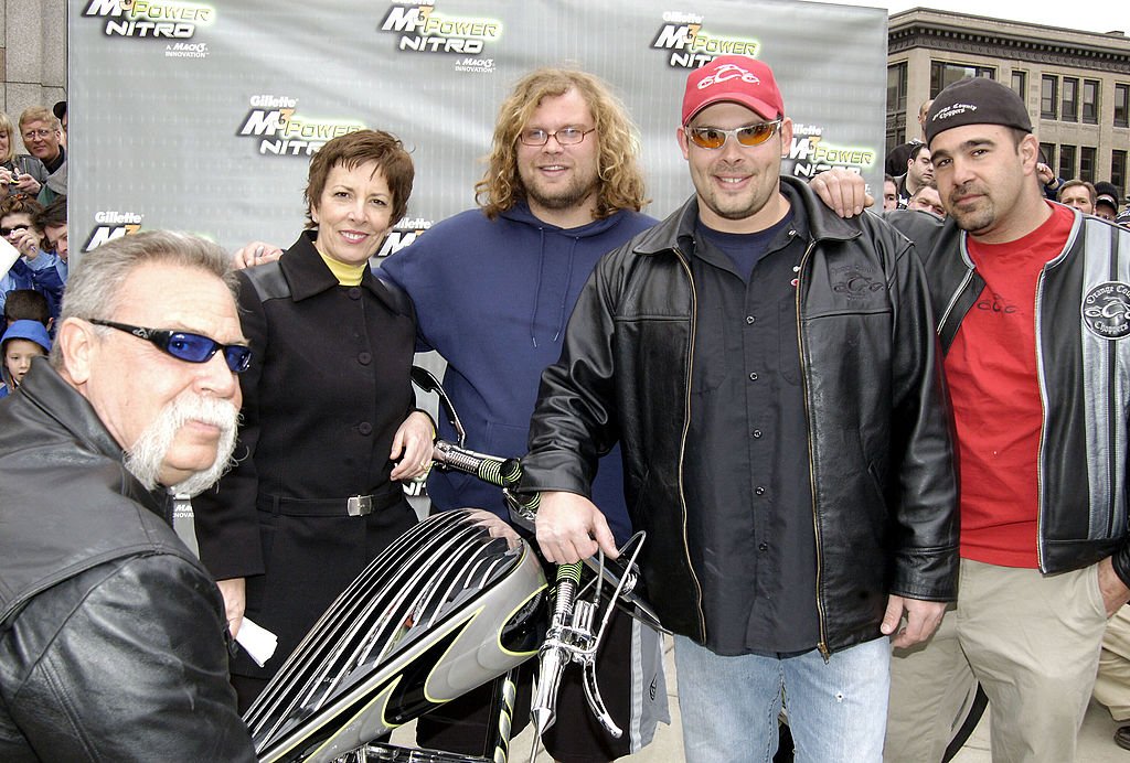 Image Credits: Getty Images / Bob Gevinski / WireImage | Paul Teutul Sr., Nichele Szynal, Mikey Teutul, Paul Teutul Jr. and Vinnie at the Orange Country Choppers presentation of the M3Power Nitro Chopper to Gillette.