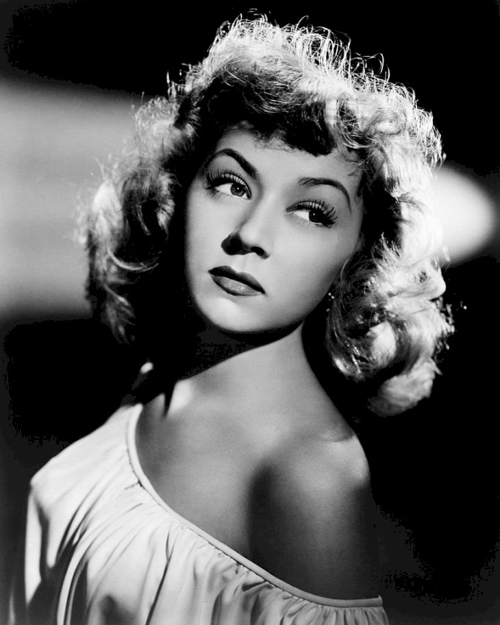 Image Credit: Getty Images/Silver Screen Collection | Gloria Grahame wearing an off-the shoulder dress, circa 1948.