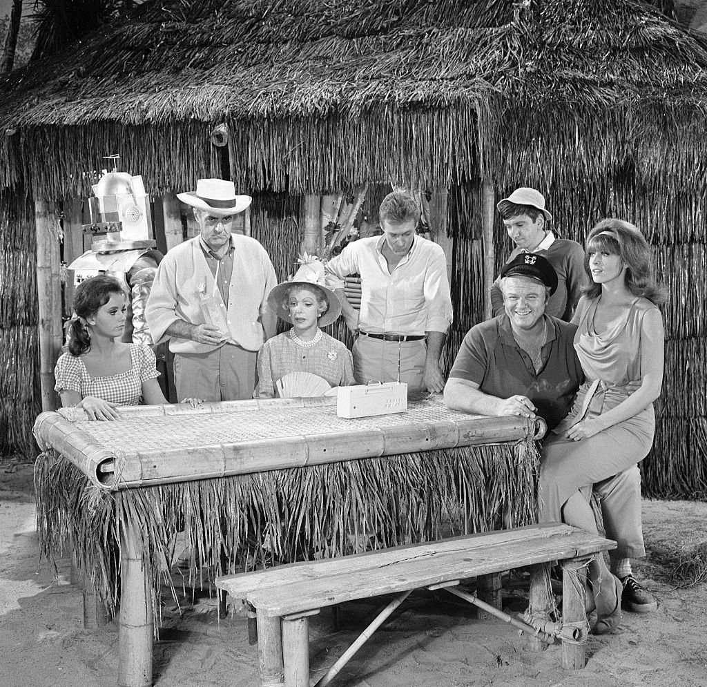 Image Credit: Getty Images / NOVEMBER 18: Gilligan's Island cast members, from left, Dawn Wells (as Mary Ann Summers), Jim Backus (as Thurston Howell III), Natalie Schafer (as Mrs. Lovey Howell), Russell Johnson (as Professor Roy Hinkley), Alan Hale, Jr. (as The Skipper Jonas Grumby, seated), Bob Denver (as Gilligan) and Tina Louise (as Ginger Grant) appearing in episode: "Gilligan's Living Doll."