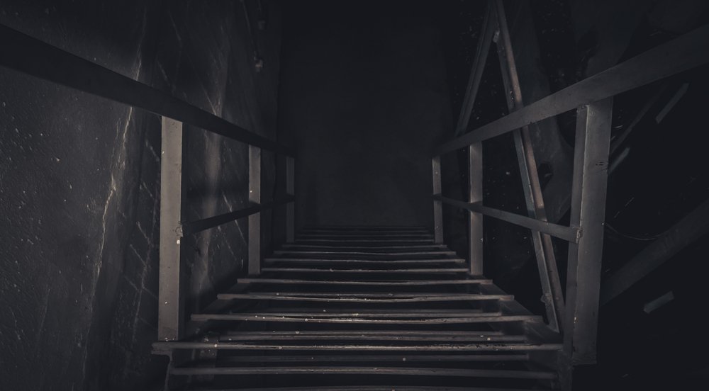 Stairs to an abandoned basement | Shutterstock
