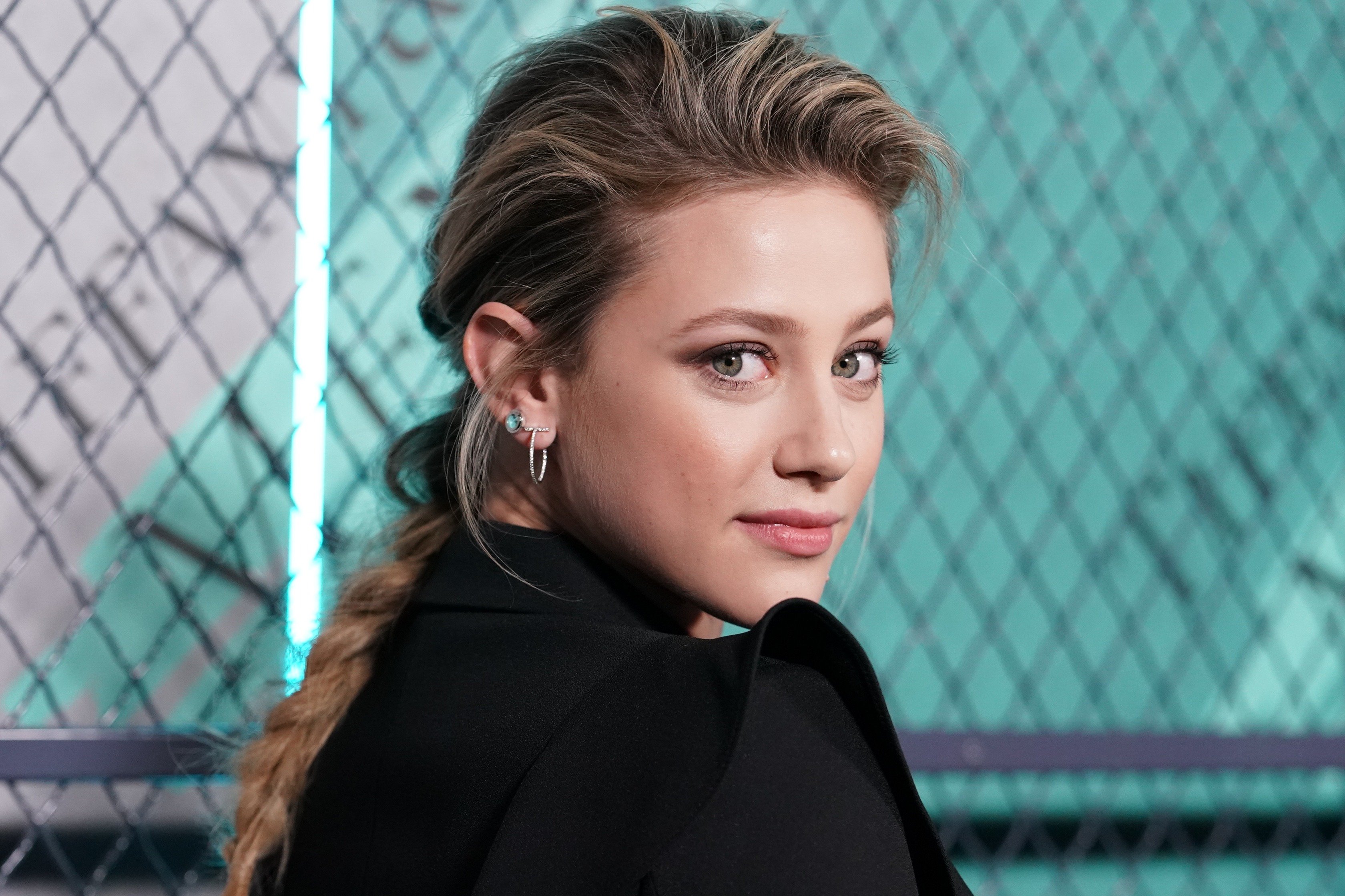 Image Credit: Getty Images/FilmMagic/Rachel Luna | Lily Reinhart attends Tiffany & Co. launch of the new Tiffany Men's Collections