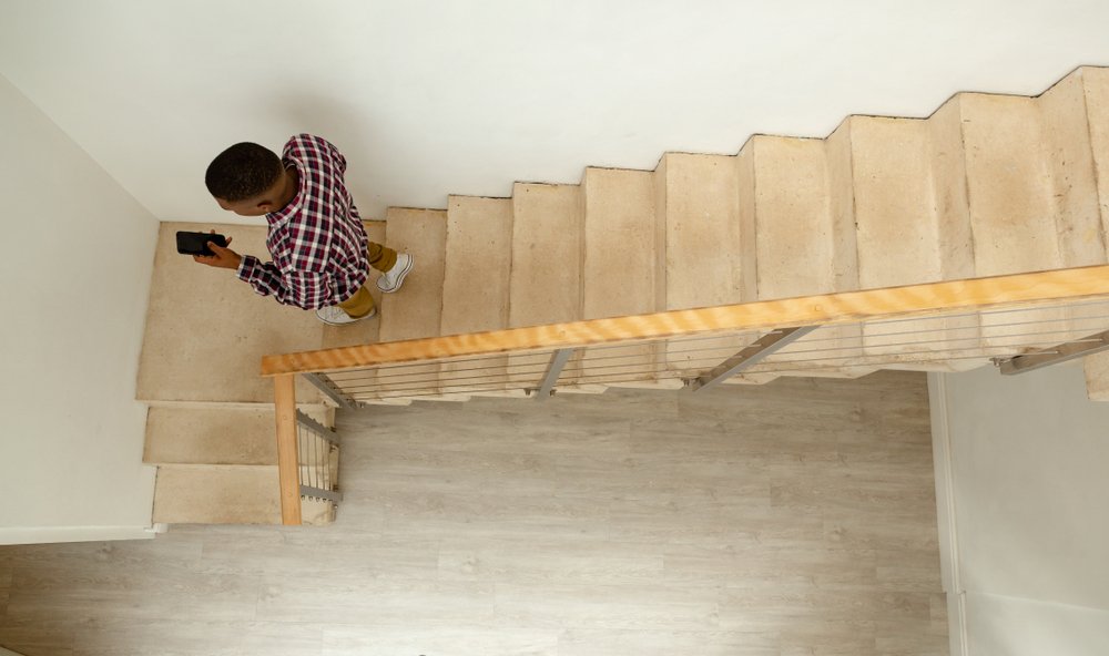 Man walks back down the stairs | Shutterstock Man walks back down the stairs | Shutterstock