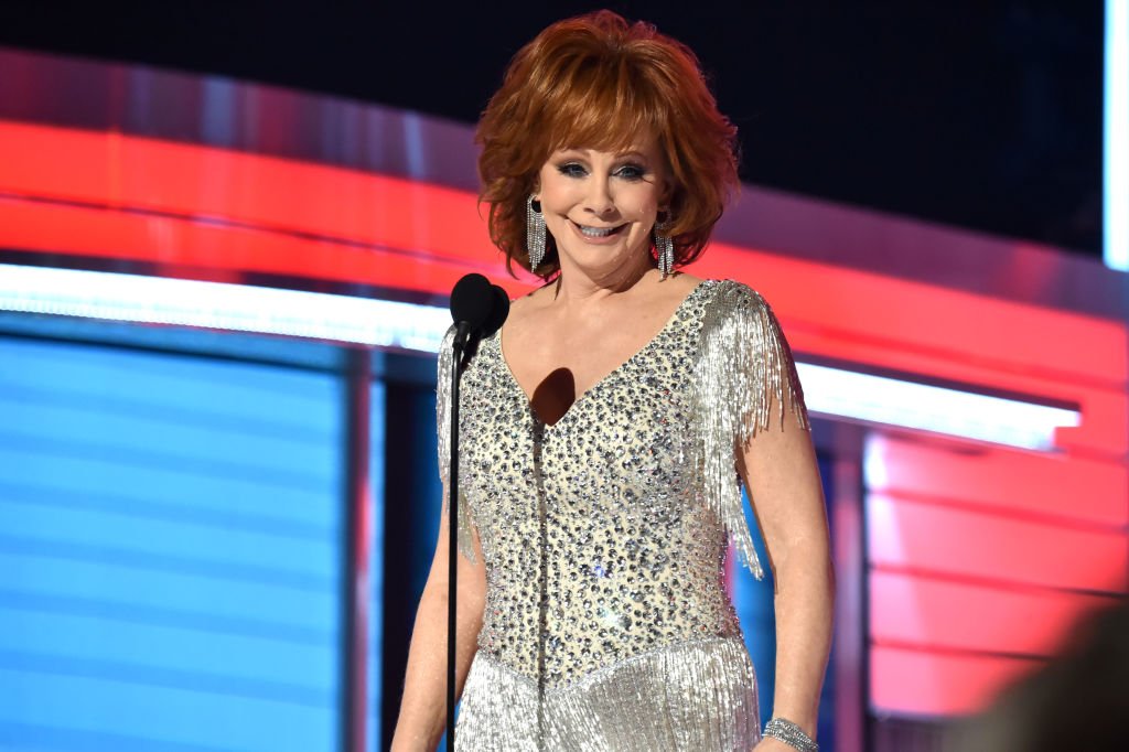 Image Credit: Getty Images / Reba McEntire speaks onstage during the 54th Academy Of Country Music Awards at MGM Grand Garden Arena on April 07, 2019.