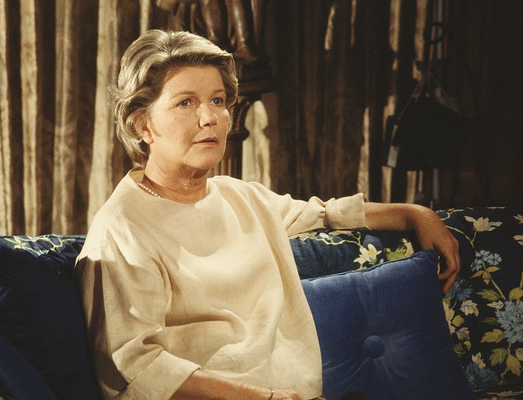 Image Credit: Getty Images / American television series 'Dallas' shows Barbara Bel Geddes (as Eleanor Southworth 'Miss Ellie' Ewing), as she sits on a sofa, 1979.