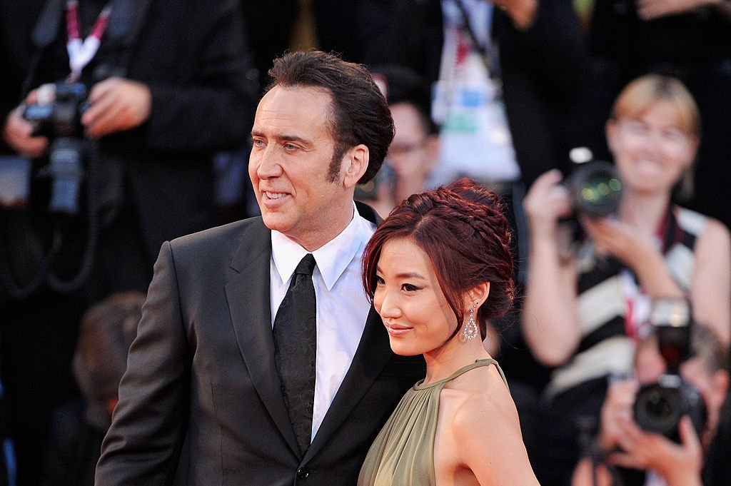 Image Credit: Getty Images / Nicolas Cage and his wife Alice Kim Cage attend the 'Joe' Premiere during The 70th Venice International Film Festival at Palazzo Del Cinema on August 30, 2013.