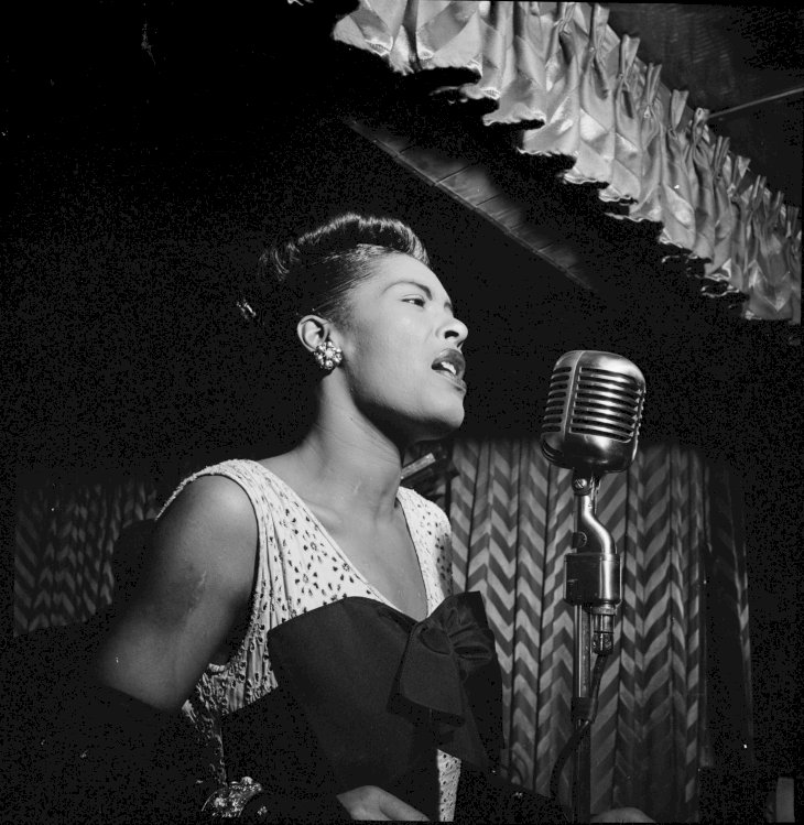 Image Credit: Getty Images / Billie Holiday performing at a show.