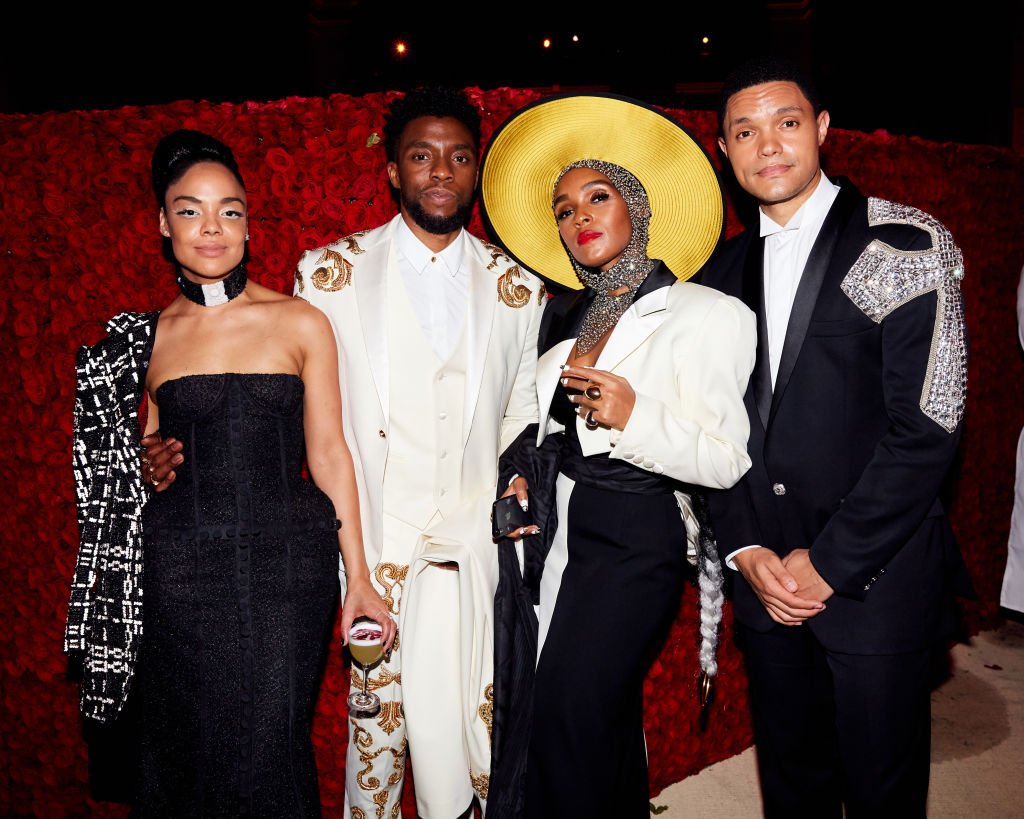 Image Credits: Getty Images / Taylor Jewell | Tessa Thompson, Chadwick Boseman, Janelle Monae, and Trevor Noah attend Heavenly Bodies: Fashion & The Catholic Imagination Costume Institute Gala at The Metropolitan Museum of Art on May 7, 2018 in New York City.