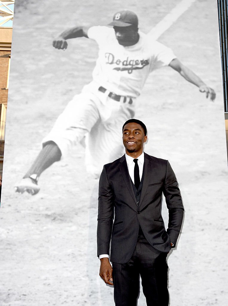 Image Credits: Getty Images / Kevin Winter | Actor Chadwick Boseman arrives at the premiere of Warner Bros. Pictures' and Legendary Pictures' "42" at the Chinese Theatre on April 9, 2013 in Los Angeles, California. Image Credits: Getty Images / Kevin Winter | Actor Chadwick Boseman arrives at the premiere of Warner Bros. Pictures' and Legendary Pictures' "42" at the Chinese Theatre on April 9, 2013 in Los Angeles, California.