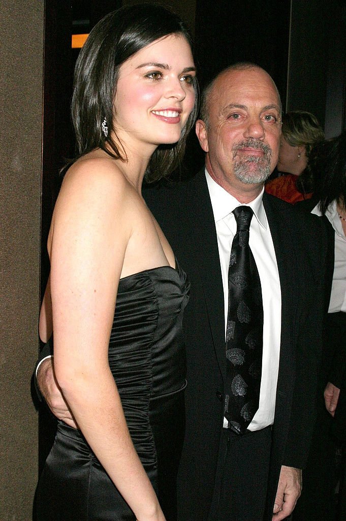 Image Credits: Getty Images / M. Von Holden / FilmMagic | Billy Joel (R) and fiance Katie Lee. Image Credits: Getty Images / M. Von Holden / FilmMagic | Billy Joel (R) and fiance Katie Lee.