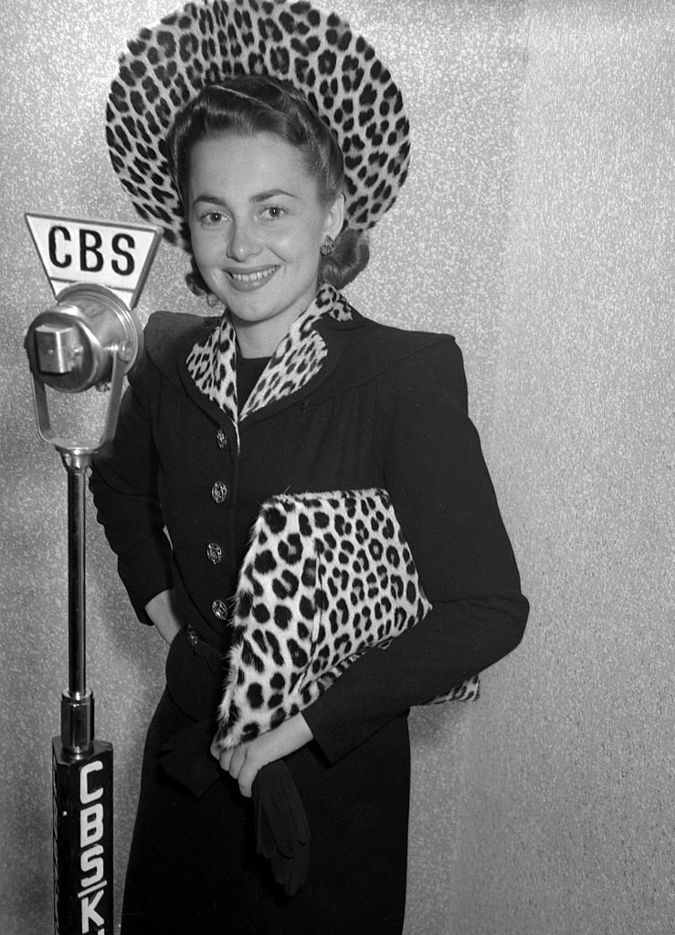 Image Credits: Getty Images / CBS | Olivia de Havilland (as Irene Dale) prepares for the CBS Lux Radio Theater adaptation of Wings of the Navy, originally broadcast October 7, 1940 Image Credits: Getty Images / CBS | Olivia de Havilland (as Irene Dale) prepares for the CBS Lux Radio Theater adaptation of Wings of the Navy, originally broadcast October 7, 1940