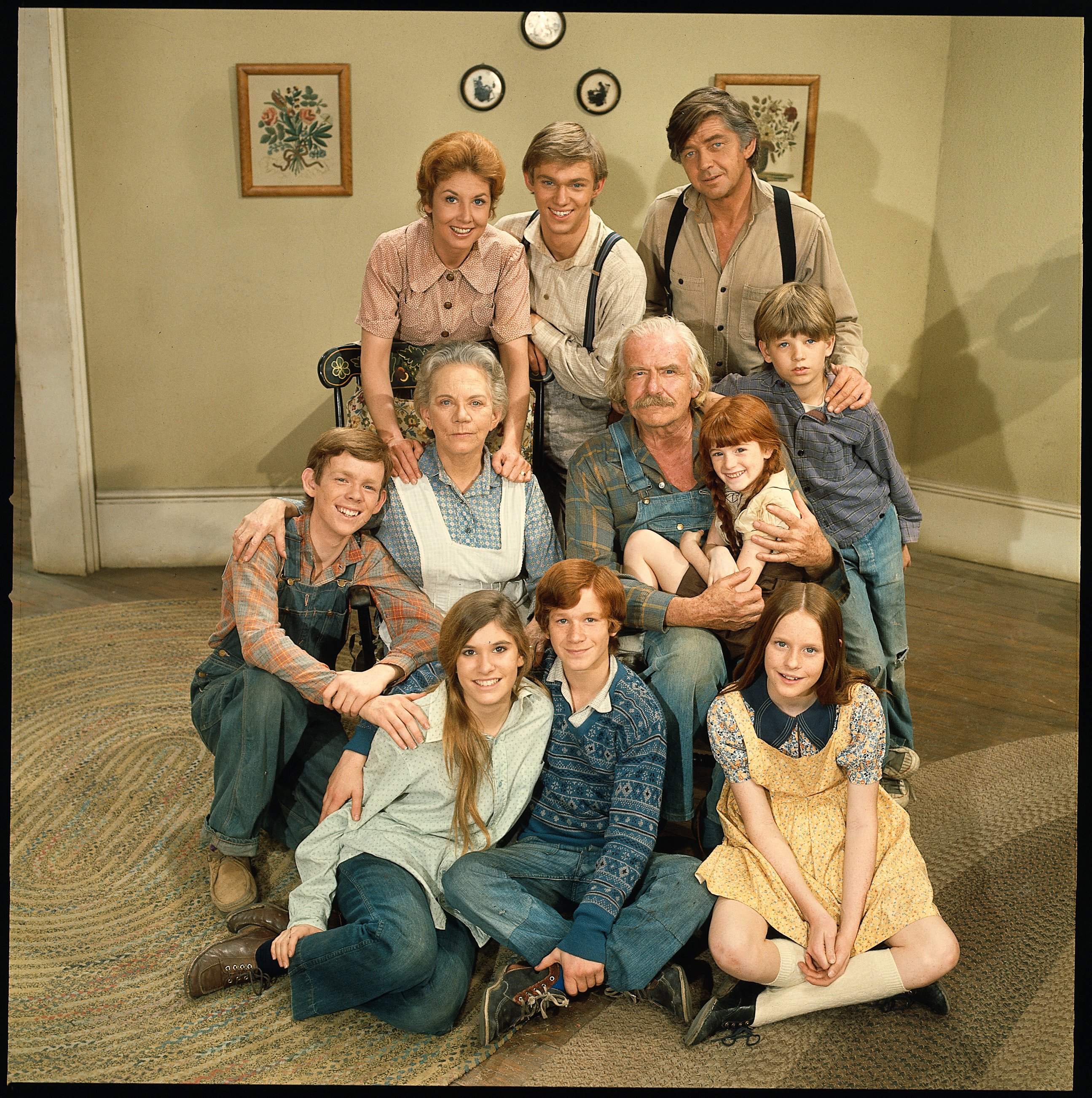 Image Credits: Getty Images / CBS | 'The Waltons''s cast poses for a promotional photo, 1972. L-R: (back row) Michael Learned, Richard Thomas and Ralph Waite; (center row) Jon Walmsley, Ellen Corby, Will Geer, Kami Cotler and David W. Harper; (bottom row) Judy Norton Taylor, Eric Scott and Elizabeth McDonough.