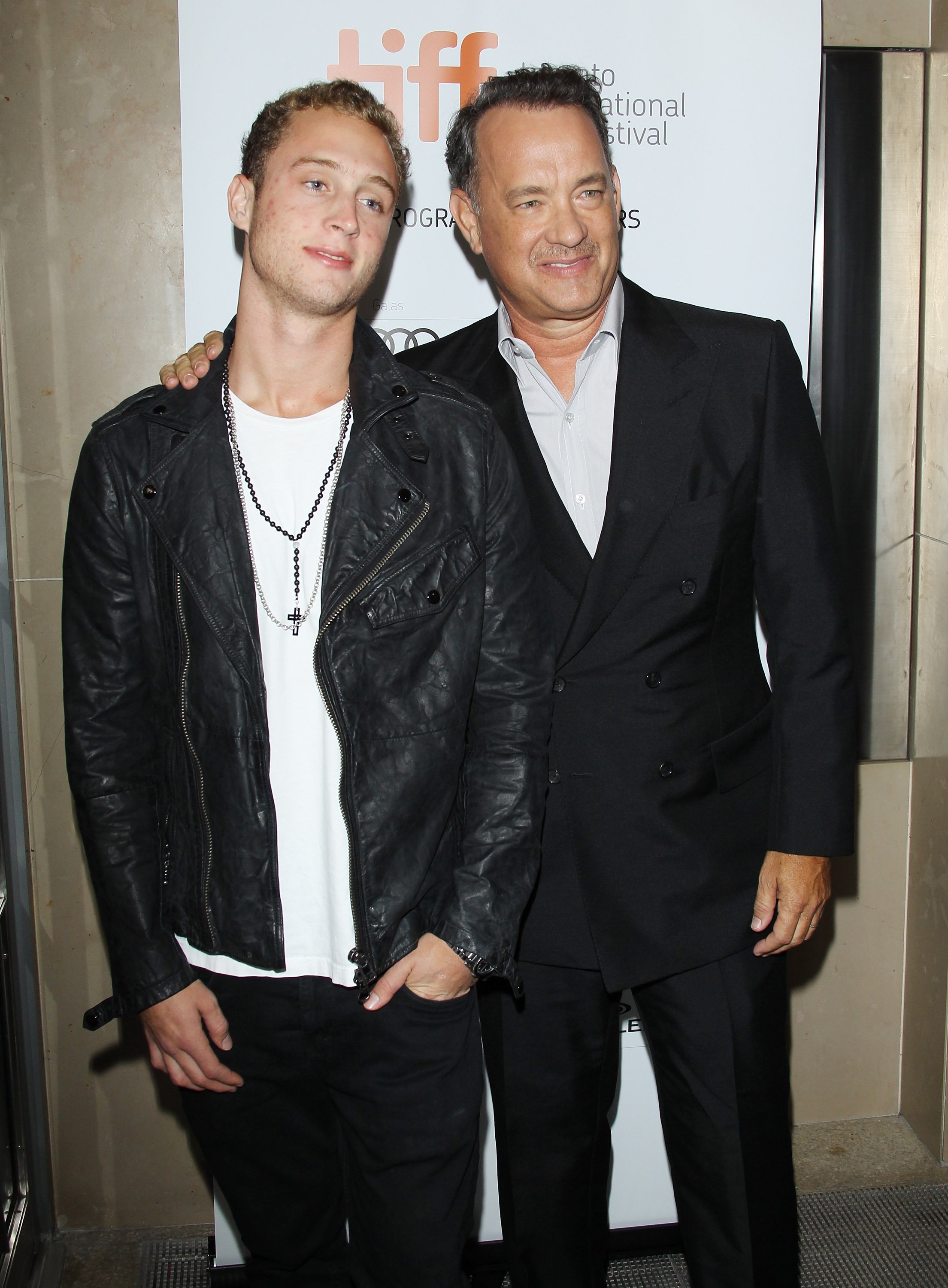 Image Credits: Getty Images / Michael Tran / FilmMagic | Tom Hanks (R) and his son Chet Hanks arrive at "Cloud Atlas" premiere during the 2012 Toronto International Film Festival held at Princess of Wales Theatre on September 8, 2012 in Toronto, Canada.