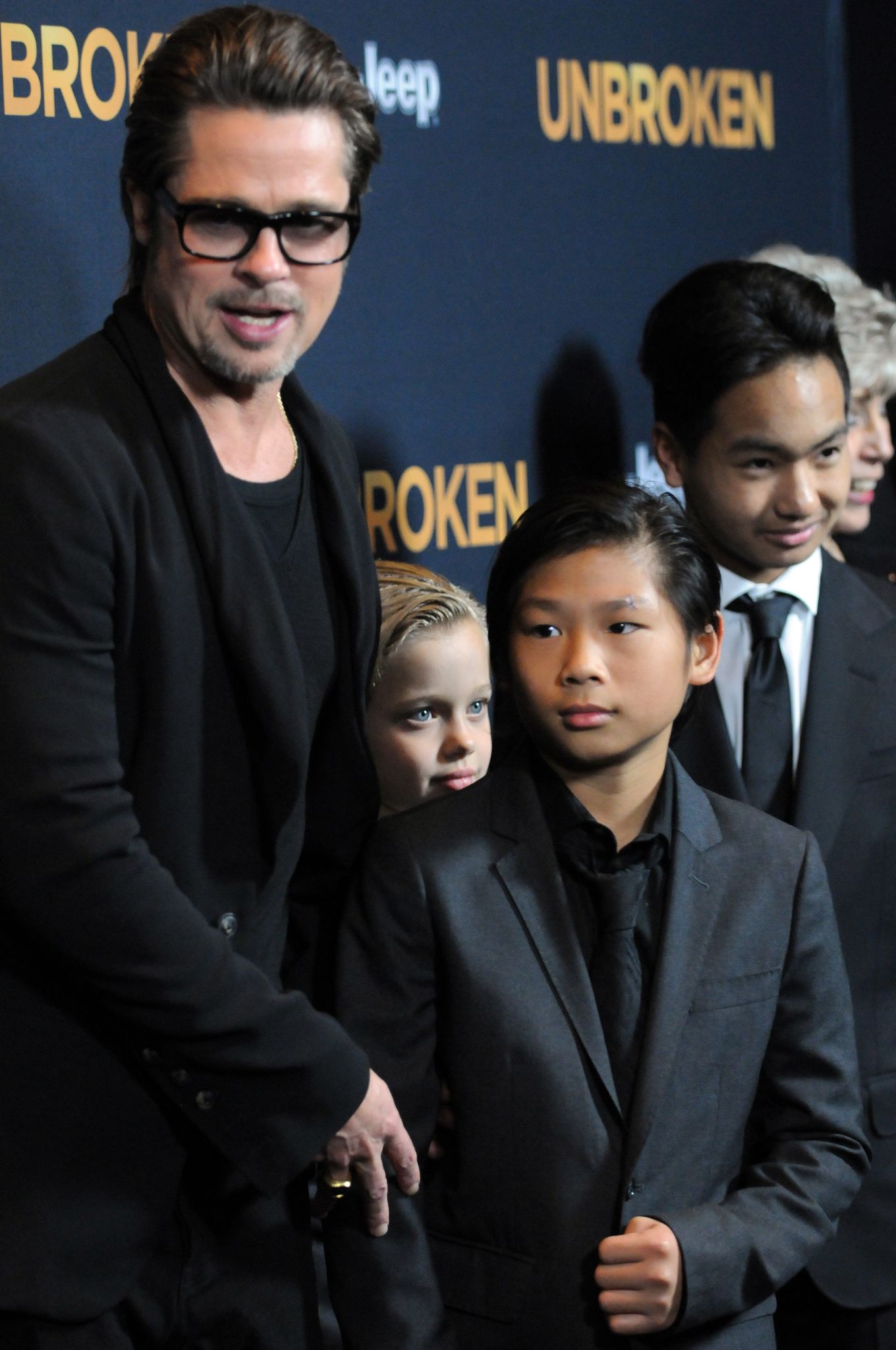 Brad Pitt with Pax, Maddox and Shiloh / Getty Images