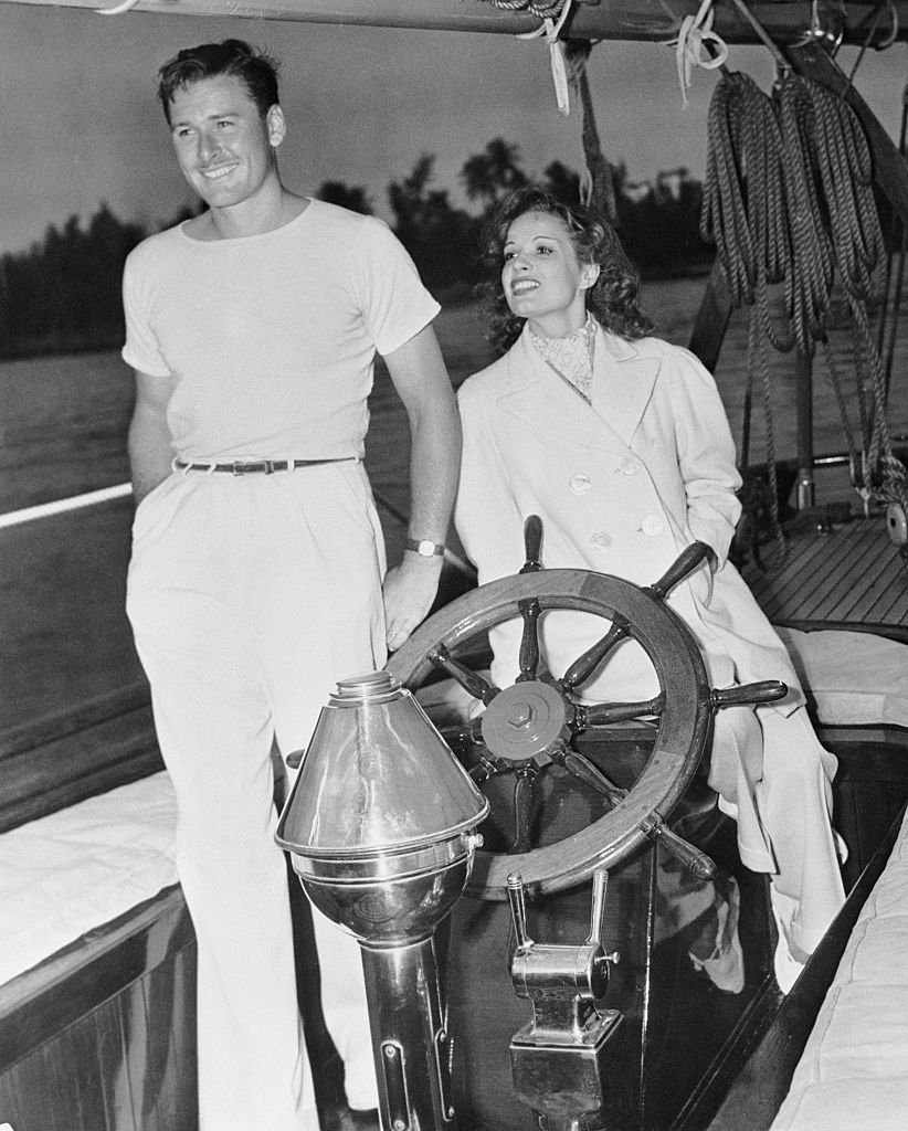 Image Source: Getty Images/Bettmann/Actor Errol Flynn and his wife, actress Lili Damita on their ketch Sirocco.